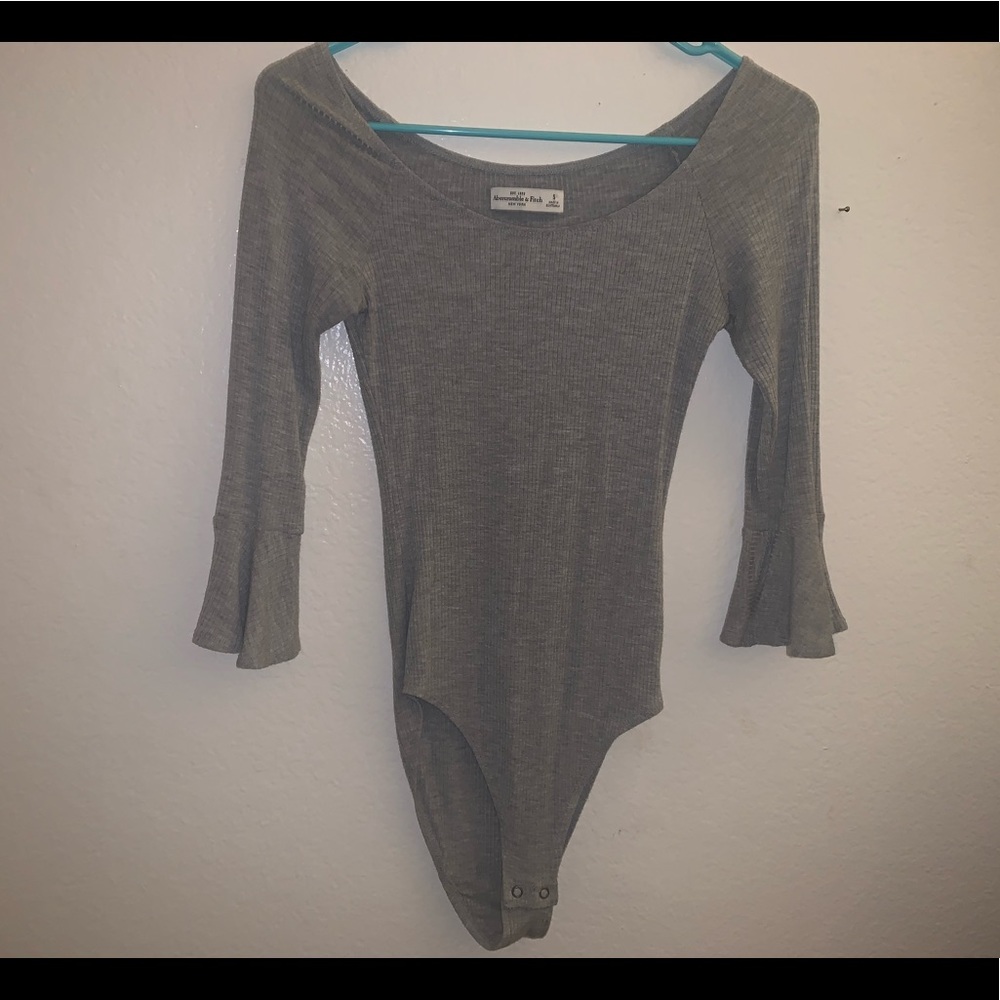 Body suit with ruffled sleeve